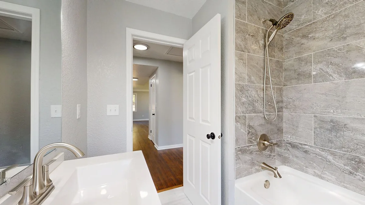Contractor renovating a bathroom interior in St. Paul, MN